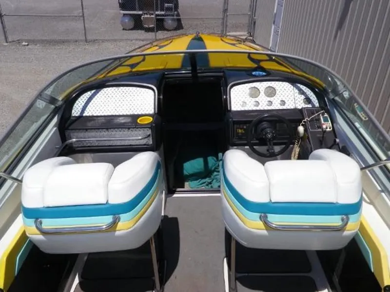 Slide: The Image of 1992 Formula Boats 27 cockpit with white, blue, and yellow seats. - 7