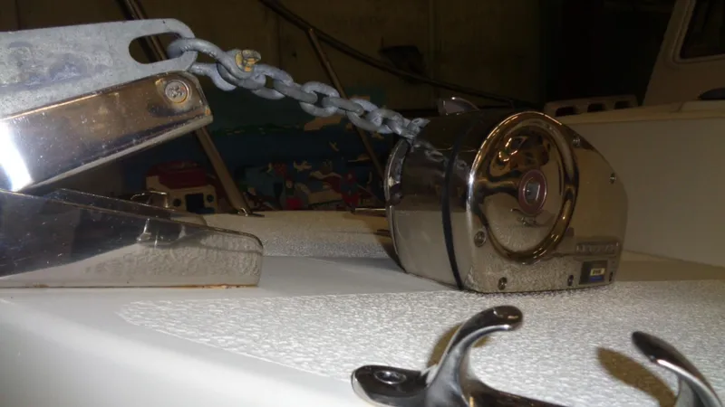 Slide: The Image of 2016 Eastern 248 Explorer boat anchor chain and winch system in close-up view. - 7
