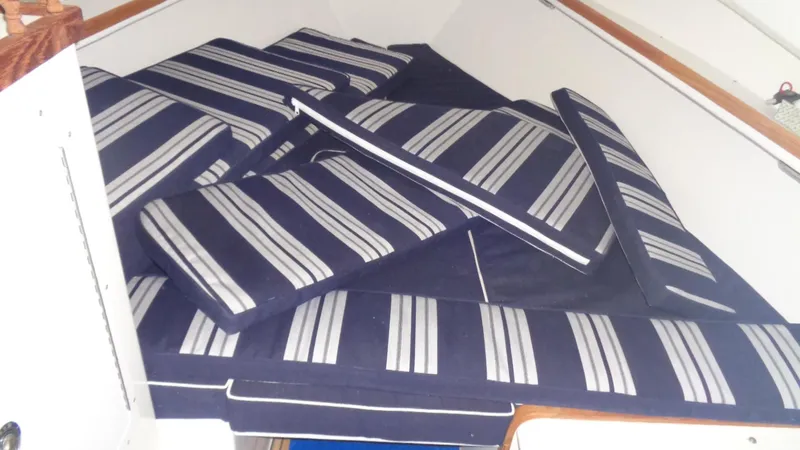 Slide: The Image of Striped cushions inside 2016 Eastern 248 Explorer boat cabin. - 9