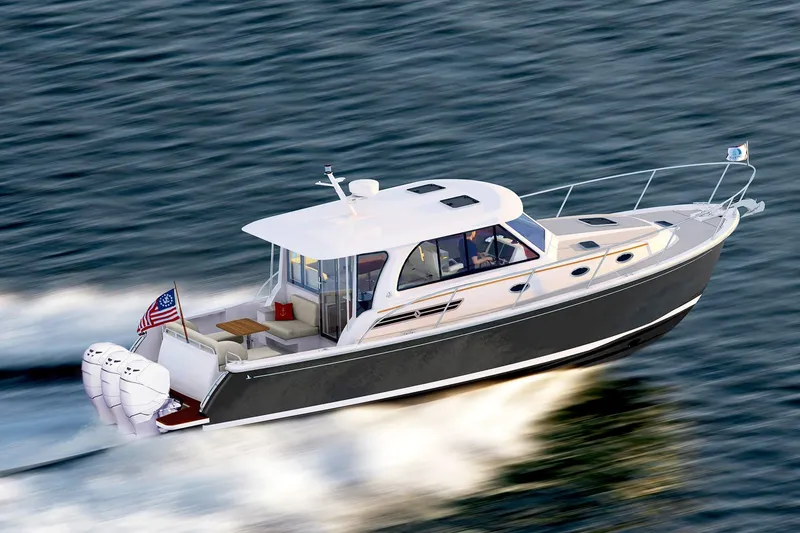 Slide: The Image of 2025 Back Cove 39O boat cruising on water. - 15