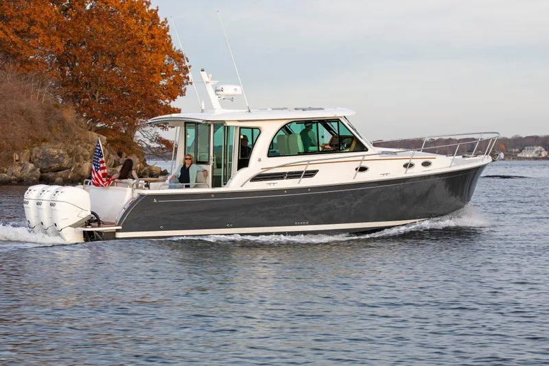Slide: The Image of 2025 Back Cove 39O cruising on a lake with autumn foliage. - 8