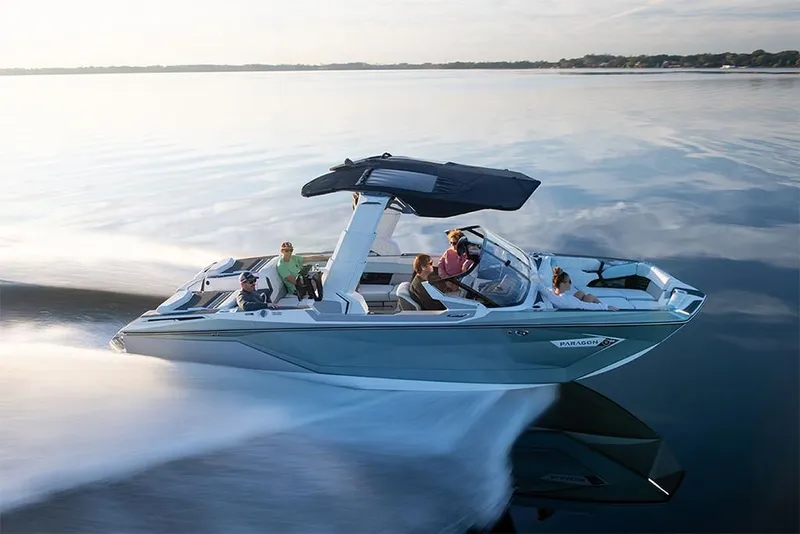 Slide: The Image of 2023 Nautique Super Air Nautique G25 Paragon cruising on a calm lake. - 1