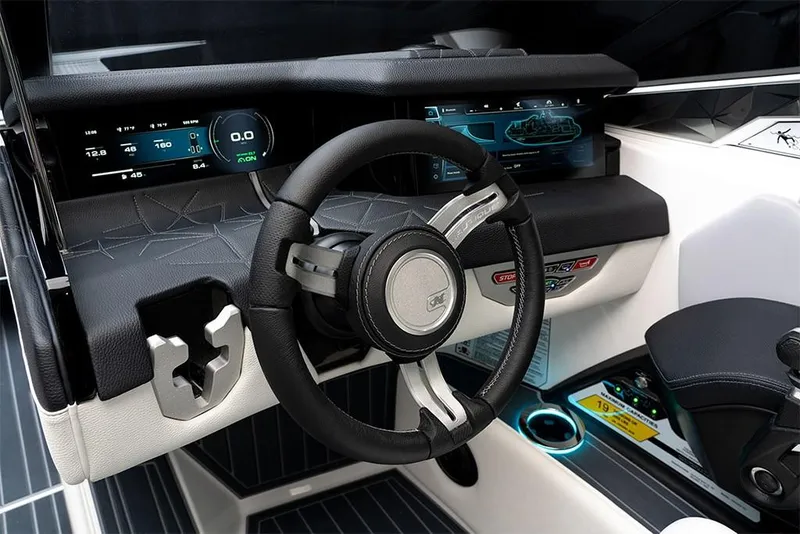 Slide: The Image of 2023 Nautique Super Air Nautique G25 Paragon dashboard with advanced controls and digital displays. - 16