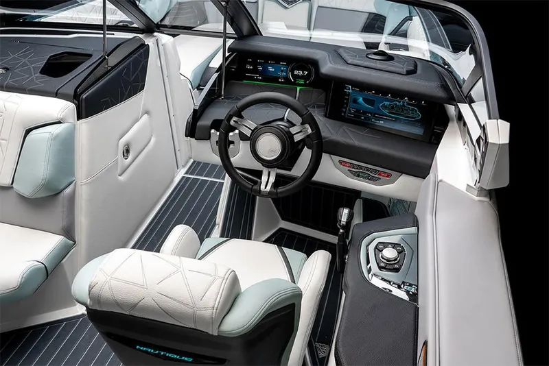 Slide: The Image of 2023 Nautique Super Air Nautique G25 Paragon cockpit with advanced controls and luxurious seating. - 19