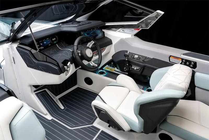 Slide: The Image of 2023 Nautique Super Air Nautique G25 Paragon cockpit with modern controls and luxurious seating. - 21