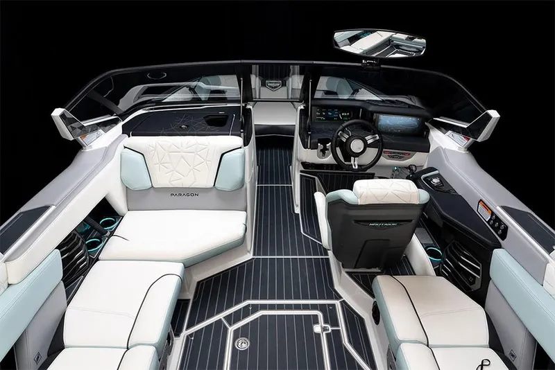 Slide: The Image of 2023 Nautique Super Air Nautique G25 Paragon interior, luxury boat seating and dashboard. - 22