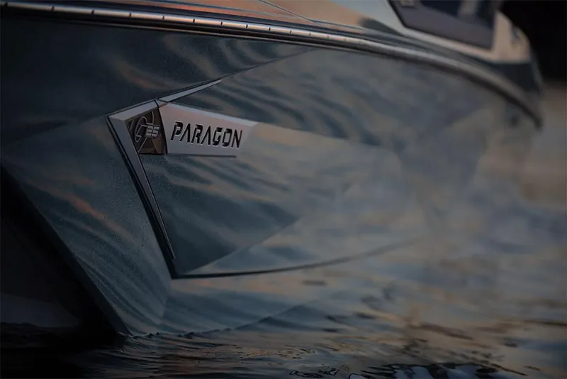 Slide: The Image of 2023 Nautique Super Air Nautique G25 Paragon boat hull close-up on water. - 3