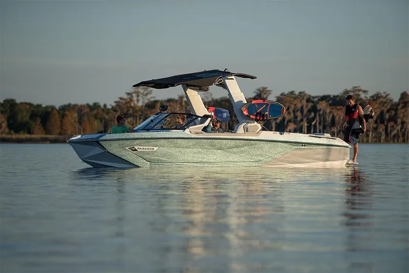 Slide: The Image of 2023 Nautique Super Air Nautique G25 Paragon on calm water with passengers. - 5