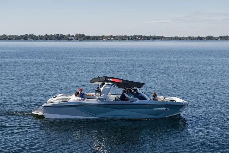 Slide: The Image of 2023 Nautique Super Air Nautique G25 Paragon cruising on a calm lake. - 6