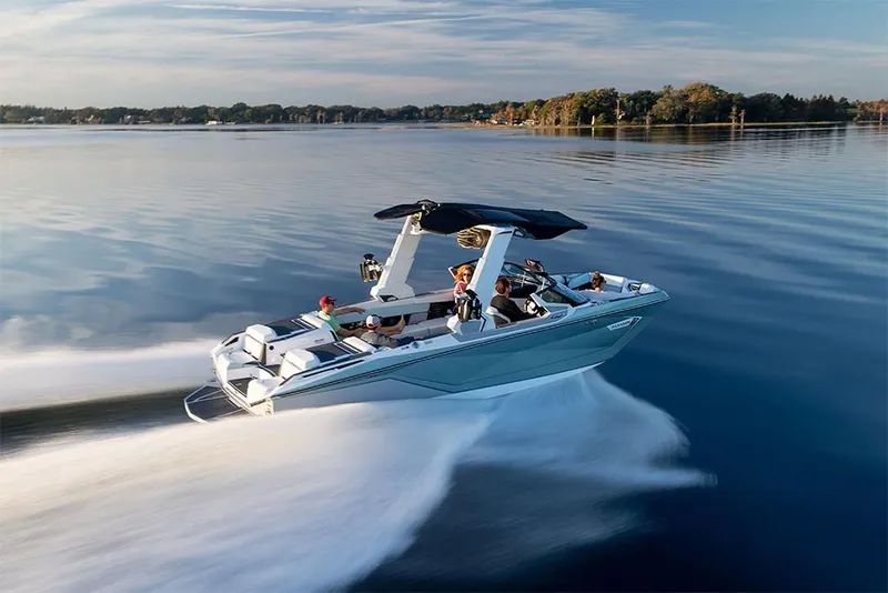 Slide: The Image of 2023 Nautique Super Air Nautique G25 Paragon speeding on a serene lake. - 8