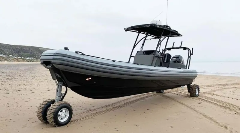 Slide: The Image of 2022 Ocean Craft Marine 8.4 M Amphibious boat on a sandy beach. - 2
