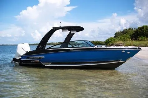 Slide: The Image of 2024 Monterey 235SS boat docked on a serene beach. - 3