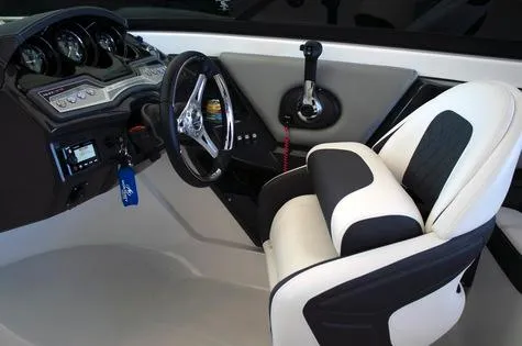 Slide: The Image of 2024 Monterey 235SS boat cockpit with steering wheel and captain's chair. - 4