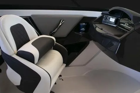 Slide: The Image of 2024 Monterey 235SS boat interior, featuring a modern captain's seat and sleek dashboard. - 6