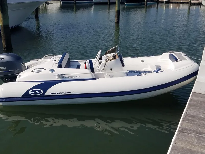 The Image of 2024 Walker Bay Generation 400 DLX inflatable boat docked in marina. - 0
