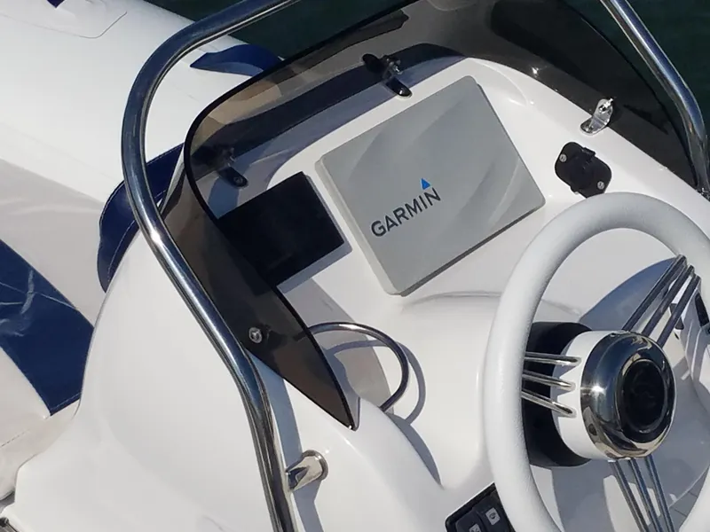 Slide: The Image of 2024 Walker Bay Generation 400 DLX boat console with Garmin navigation system. - 2