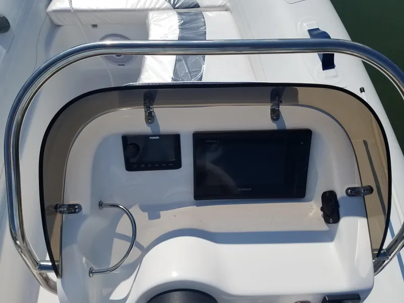 Slide: The Image of 2024 Walker Bay Generation 400 DLX boat dashboard with navigation controls. - 3