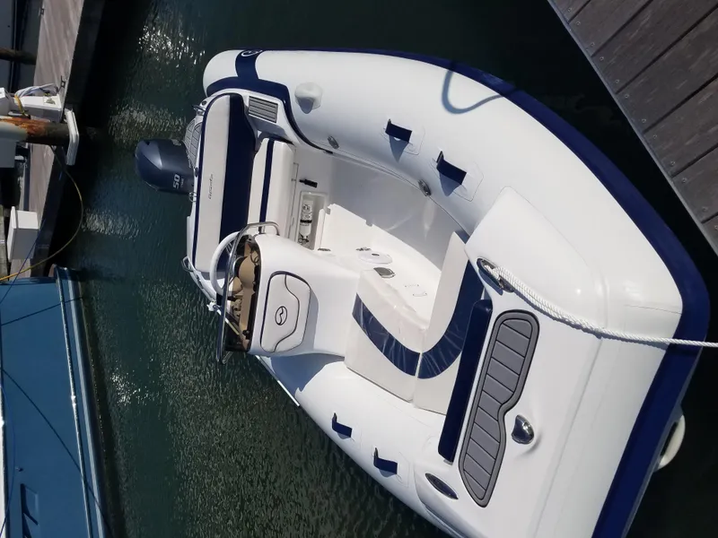 Slide: The Image of 2024 Walker Bay Generation 400 DLX inflatable boat docked in marina. - 6