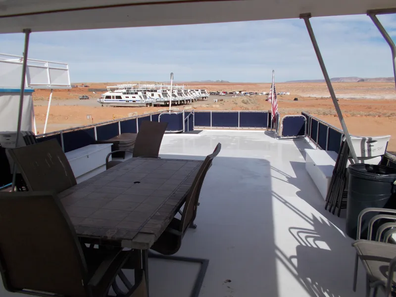 Slide: The Image of Upper deck of 2006 American Waterways Sapphire Skies houseboat with outdoor dining area. - 27