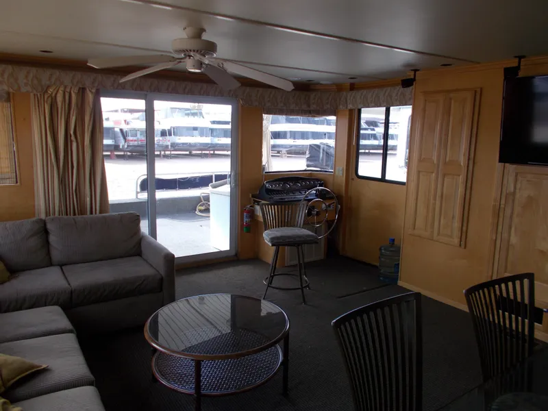 Slide: The Image of Interior of 2006 American Waterways Sapphire Skies houseboat with cozy seating and large windows. - 4