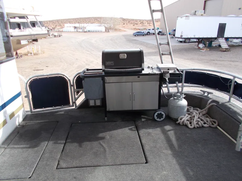 Slide: The Image of Outdoor deck of 2006 American Waterways Sapphire Skies houseboat with grill and storage. - 7