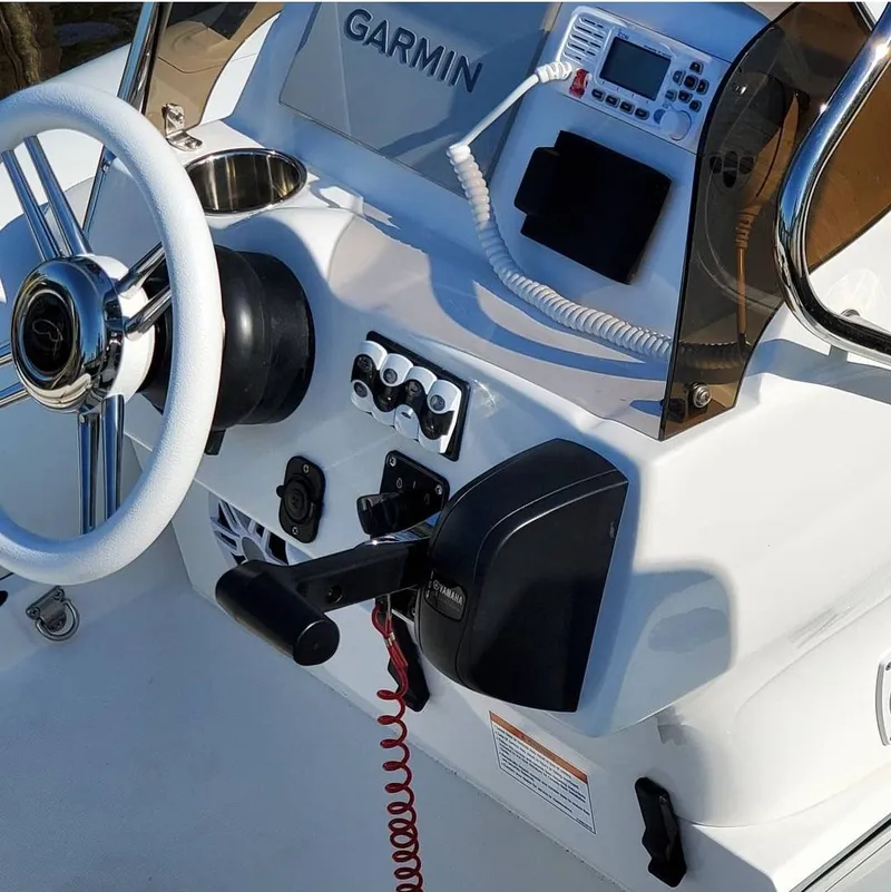 Slide: The Image of Control panel of a 2025 Walker Bay Venture boat with Garmin navigation system. - 2
