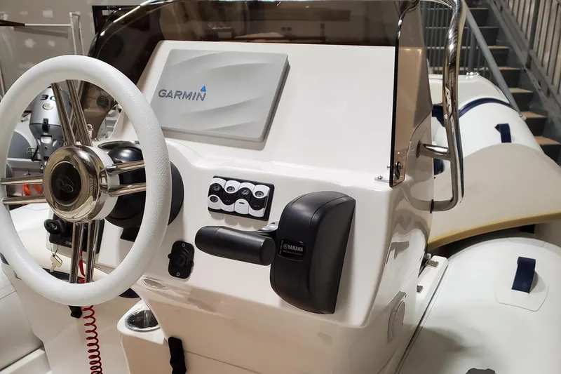 Slide: The Image of 2025 Walker Bay Venture boat console with Garmin navigation system. - 7