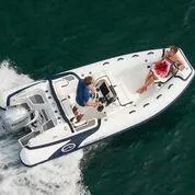 Slide: The Image of 2025 Walker Bay Venture boat cruising with two people onboard. - 8