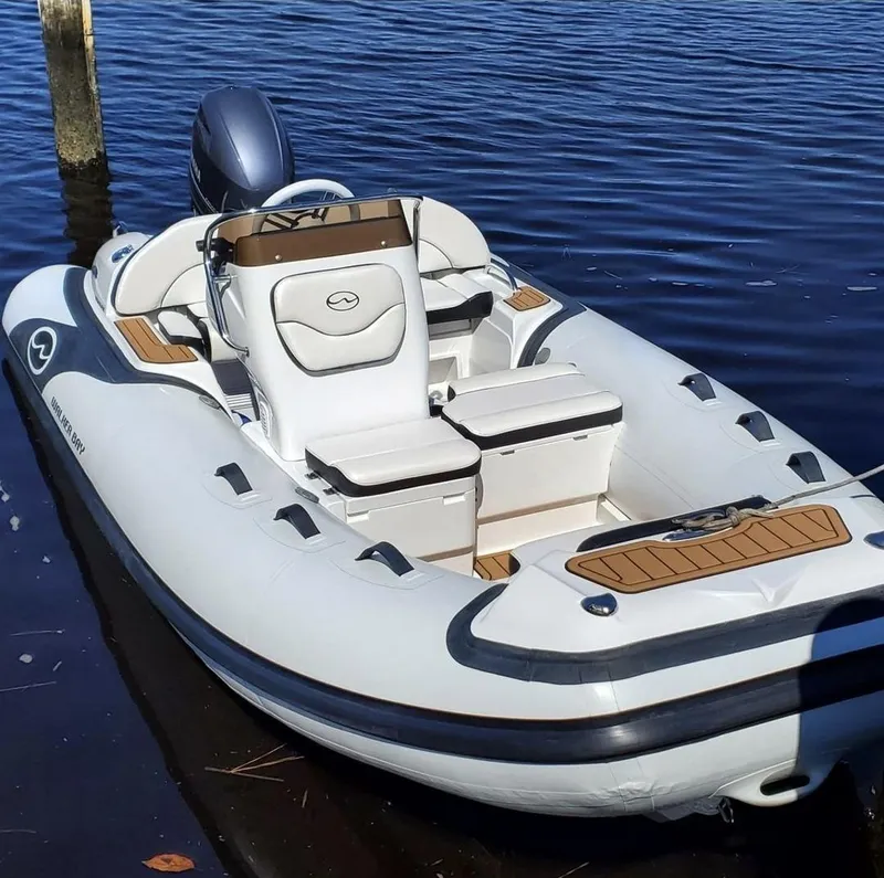 Slide: The Image of 2025 Walker Bay Venture inflatable boat on water. - 6