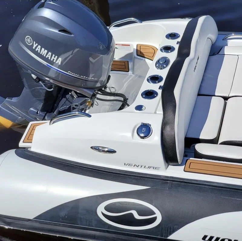 Slide: The Image of 2025 Walker Bay Venture boat with Yamaha outboard motor. - 9