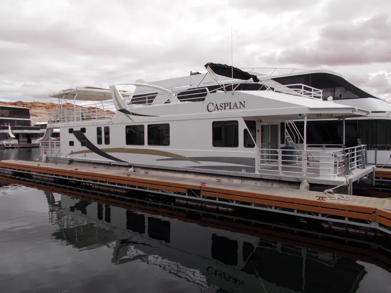 Slide: The Image of Twin Anchors Caspian #3 2005 houseboat docked at marina with calm water reflection. - 1