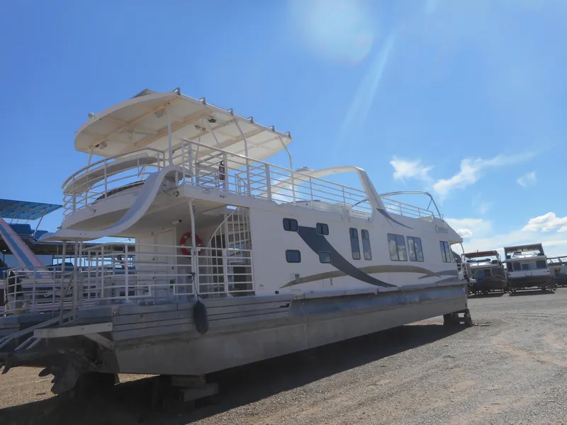 Slide: The Image of 2005 Twin Anchors Caspian #3 houseboat under clear blue sky. - 12
