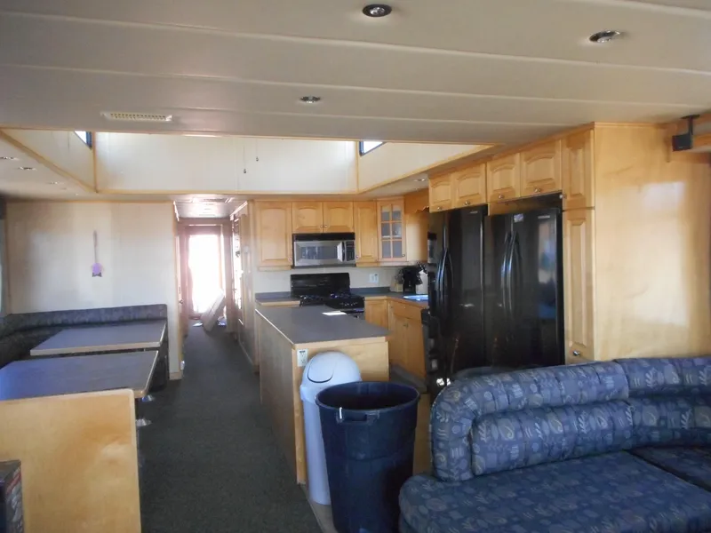 Slide: The Image of Spacious 2005 Twin Anchors Caspian #3 houseboat interior with kitchen and seating area. - 29