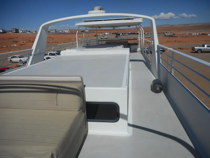 Slide: The Image of Twin Anchors Caspian #3 houseboat, 2005 model, spacious deck with seating, desert backdrop. - 32