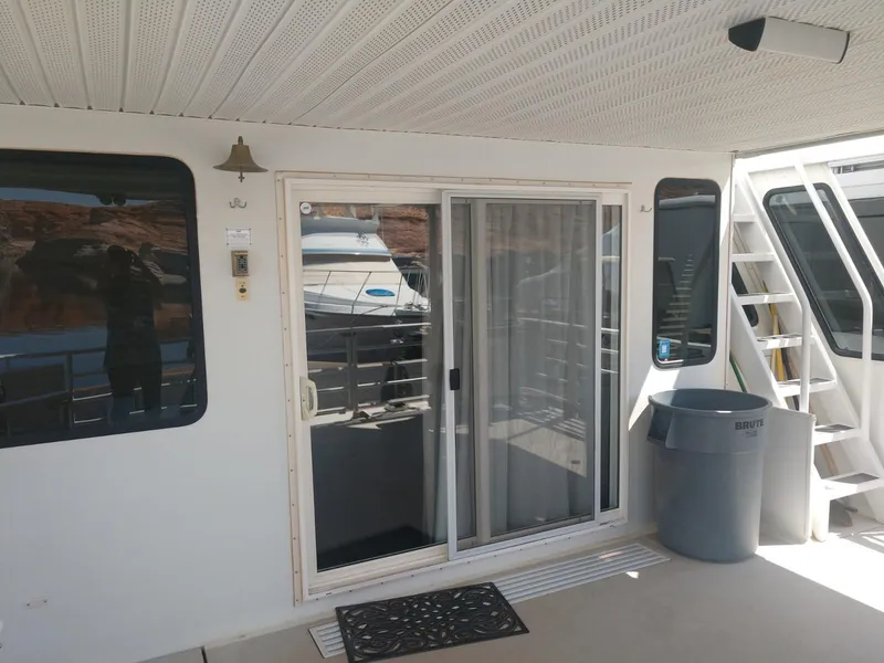 Slide: The Image of Twin Anchors Caspian #3 2005 houseboat exterior with sliding glass door and staircase. - 4