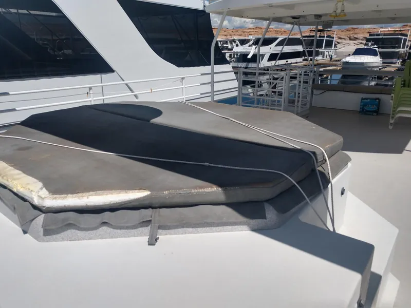 Slide: The Image of Twin Anchors Caspian #3 2005 houseboat with covered hot tub on deck. - 7