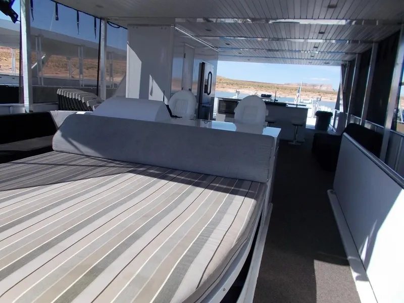 Slide: The Image of Luxurious interior of 2015 Bravada Intrepid Share #1 houseboat with spacious seating and scenic views. - 2