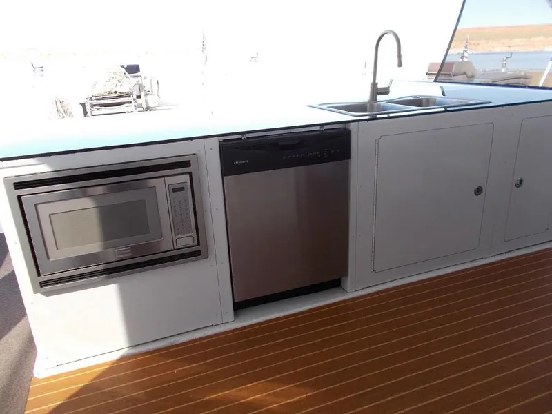 Slide: The Image of Modern kitchen area on 2015 Bravada Intrepid Trip #1 boat with microwave and sink. - 8
