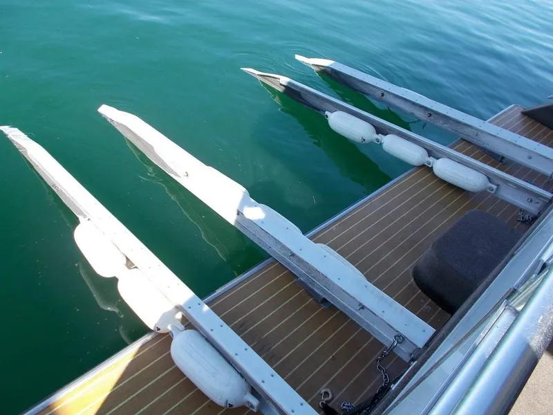Slide: The Image of Bravada Intrepid Trip #1 2015 boat deck with metal rails over clear water. - 9