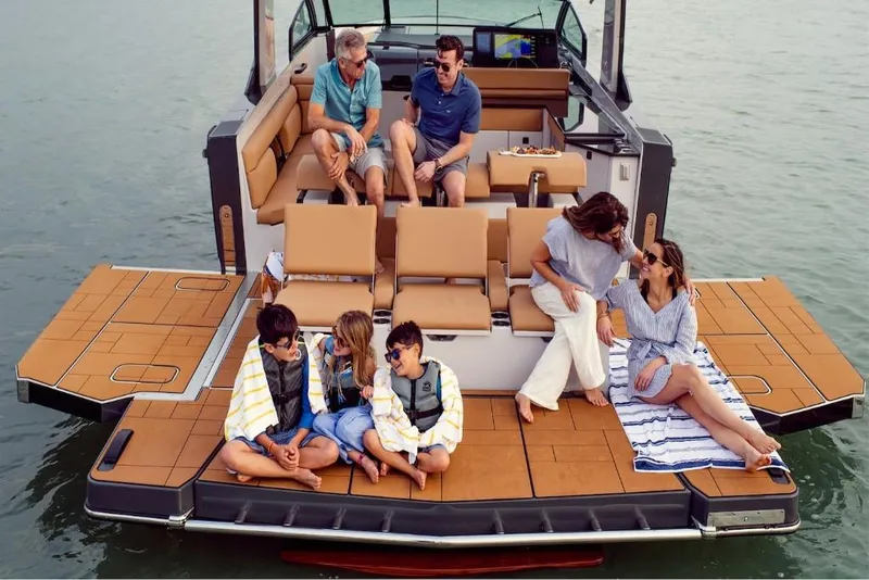 Slide: The Image of 2023 Aviara AV40 boat with people relaxing on deck. - 14