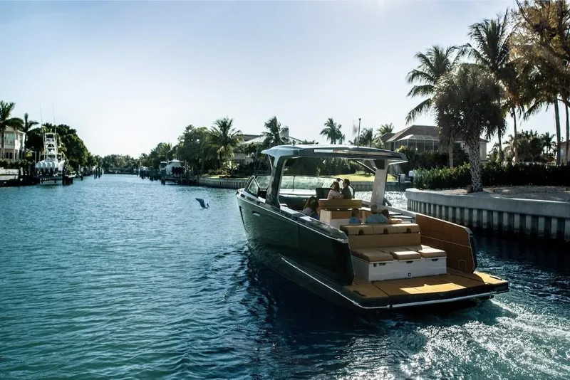 Slide: The Image of 2023 Aviara AV40 luxury boat cruising on a sunny canal. - 3