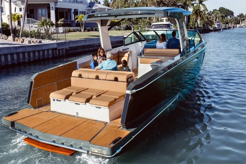 Slide: The Image of 2023 Aviara AV40 luxury boat cruising with passengers on a sunny day. - 6