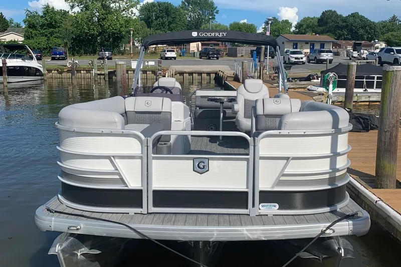 Slide: The Image of 2020 Sweetwater 2286 SFL pontoon boat docked at a marina. - 5