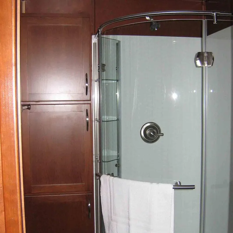 Slide: The Image of Modern bathroom in 2010 Bravada Dream Catcher Trip 14 RV with glass shower. - 6