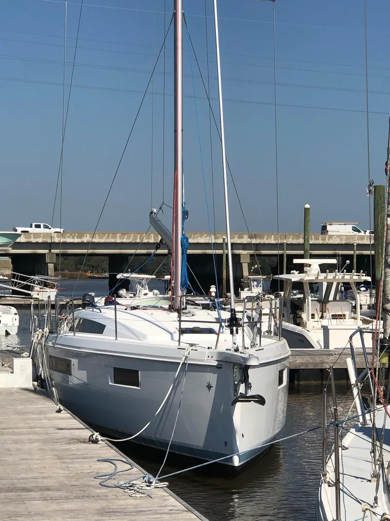 The Image of 2024 Jeanneau Sun Odyssey 410 docked at a marina. - 0
