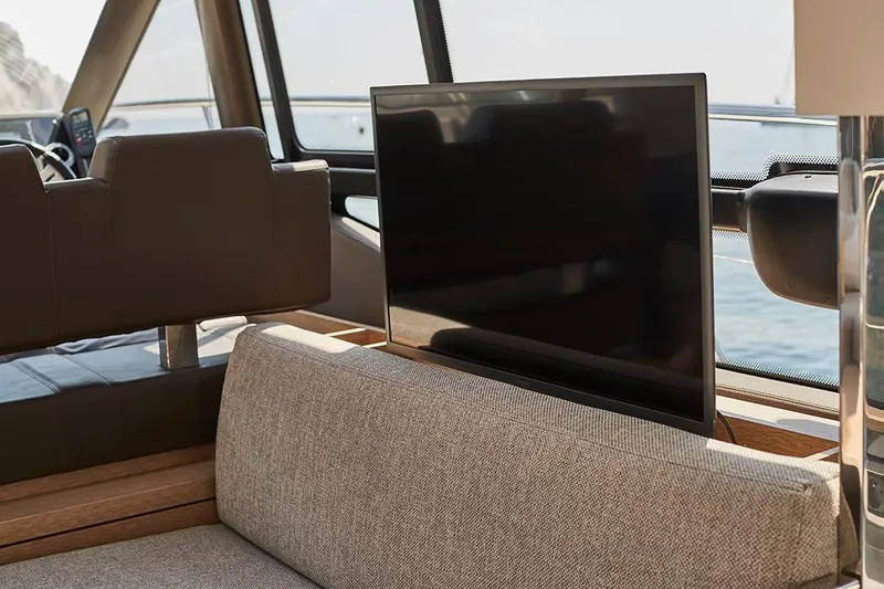 Slide: The Image of Interior of 2023 Prestige 460 S yacht with TV and seating area. - 1