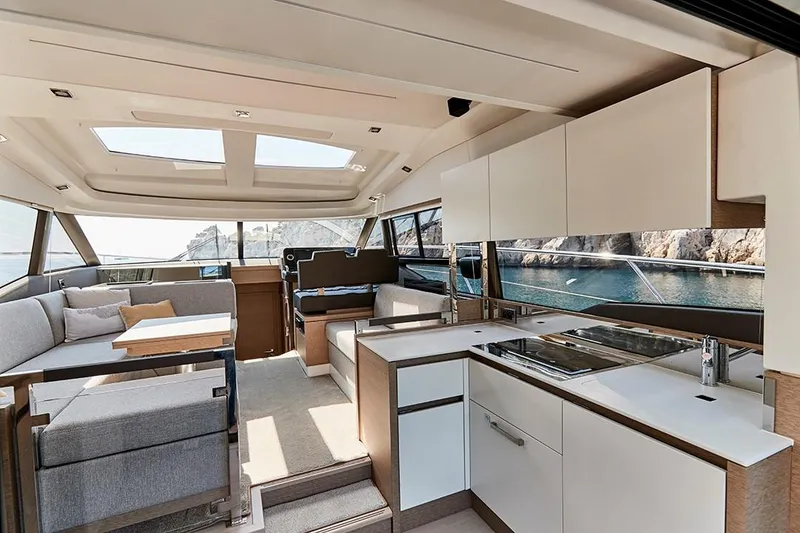 Slide: The Image of Modern interior of 2023 Prestige 460 S yacht with kitchen and seating area. - 6