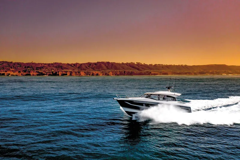 The Image of Prestige 420 S 2023 yacht cruising on the ocean at sunset. - 0