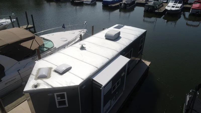 Slide: The Image of Harbor Home 24' 2020 houseboat docked at marina with other boats. - 13