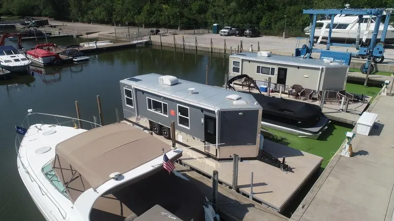 Slide: The Image of Houseboat docked at marina, Harbor Home 24' model, 2020. - 8